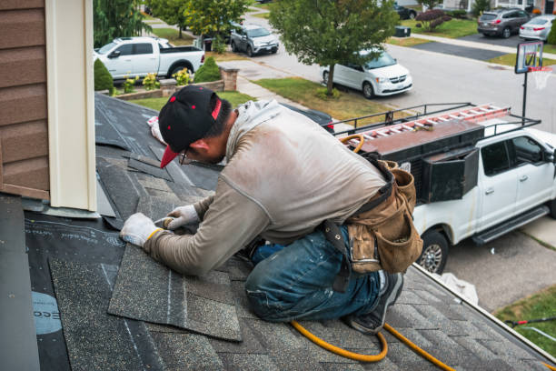 Professional Roofing technician working in Thompson, IA
